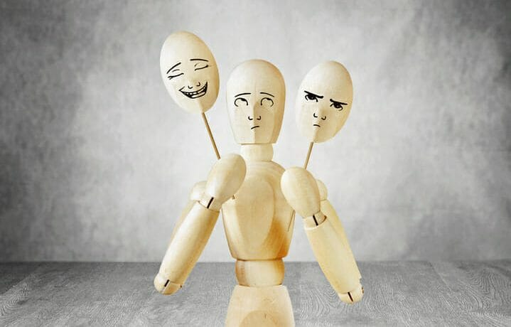 Man on stage can not choose a cheerful or sad mask Man on stage can not choose a cheerful or sad mask