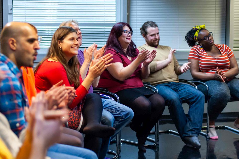 Audience clapping in Hoopla workshop